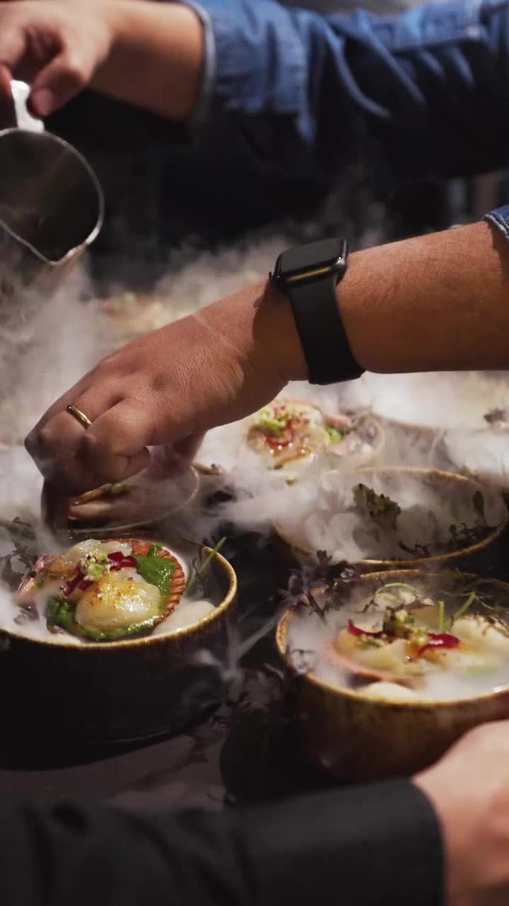 Omakase plates arranged on a dark table, shot from above