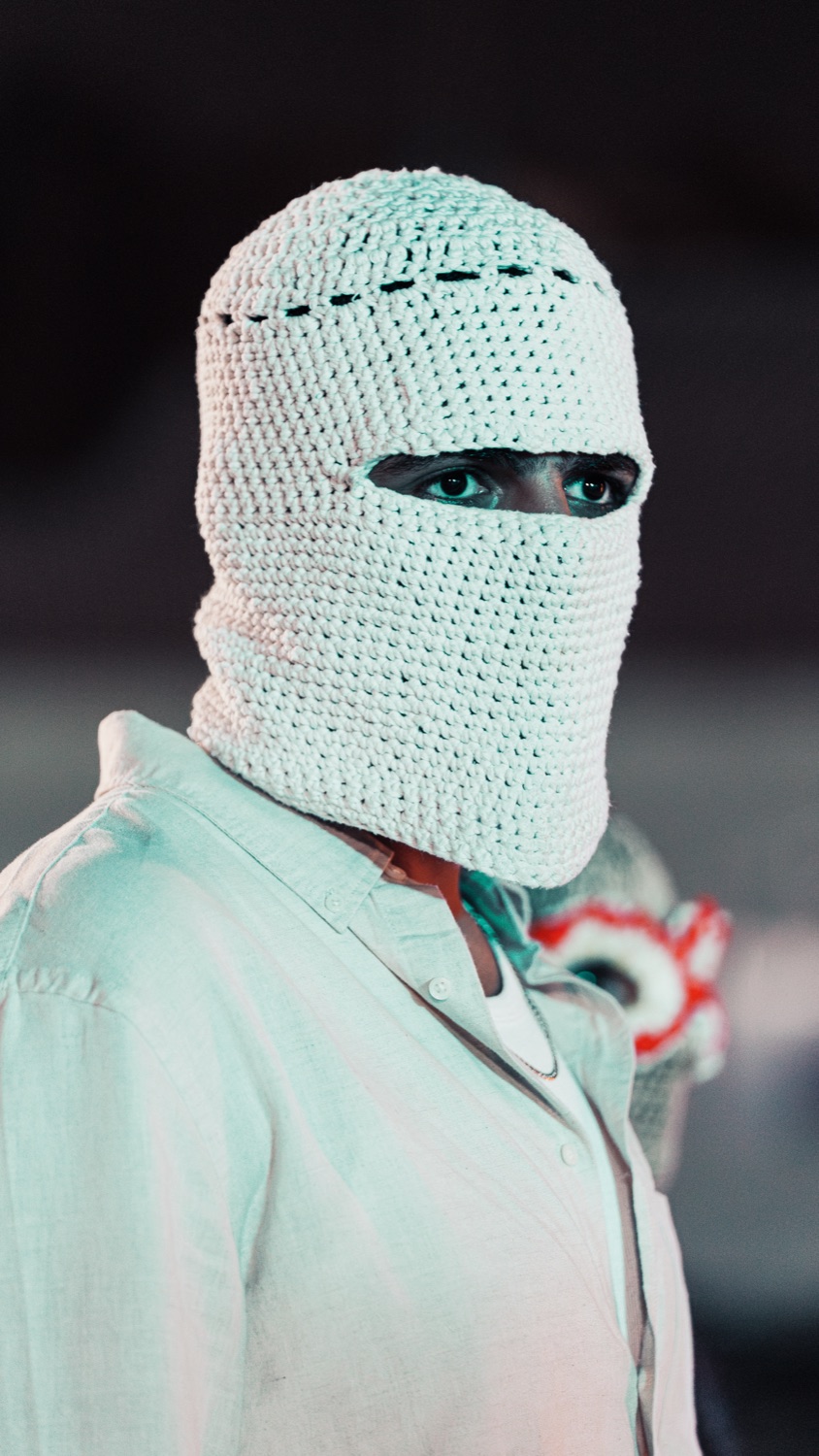 Portrait in a white crochet balaclava