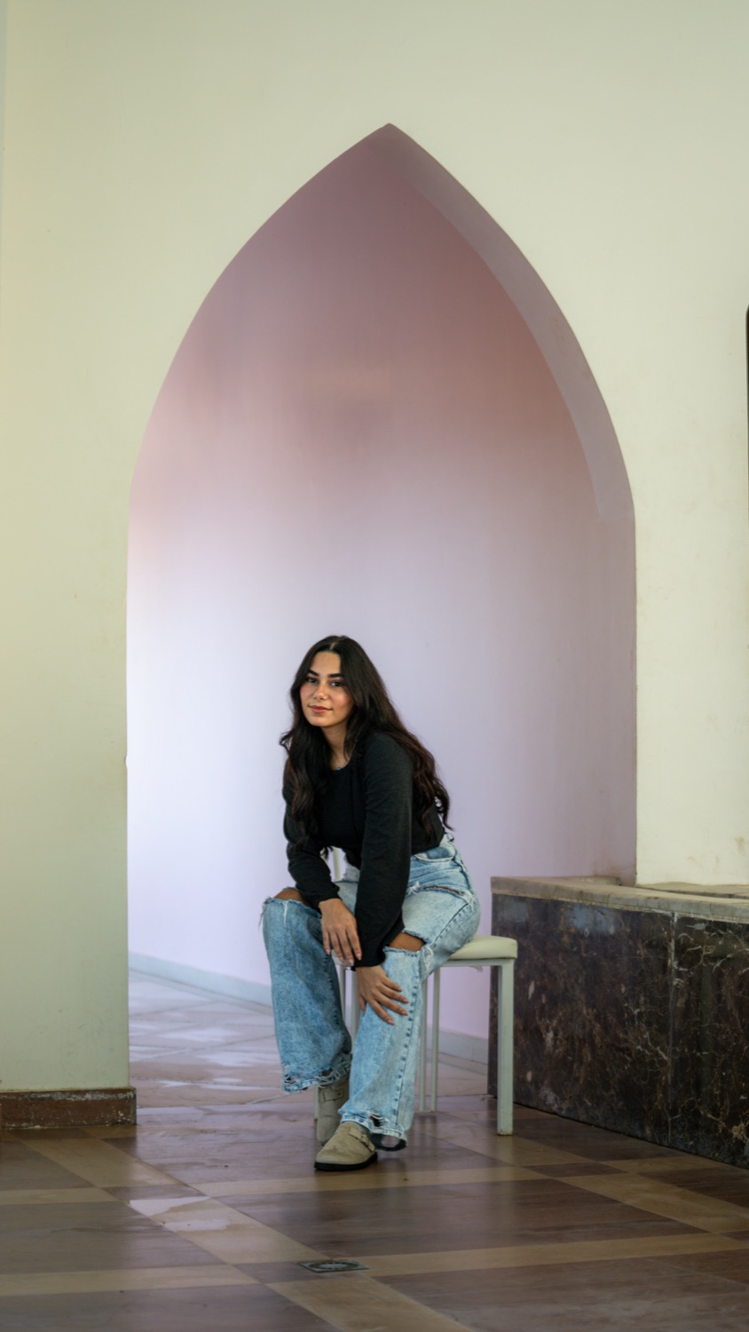A portrait framed in a pink arch