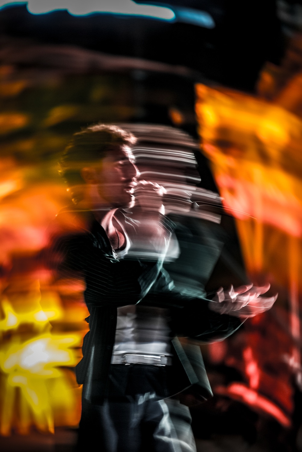 A performer blurred in amber stage light