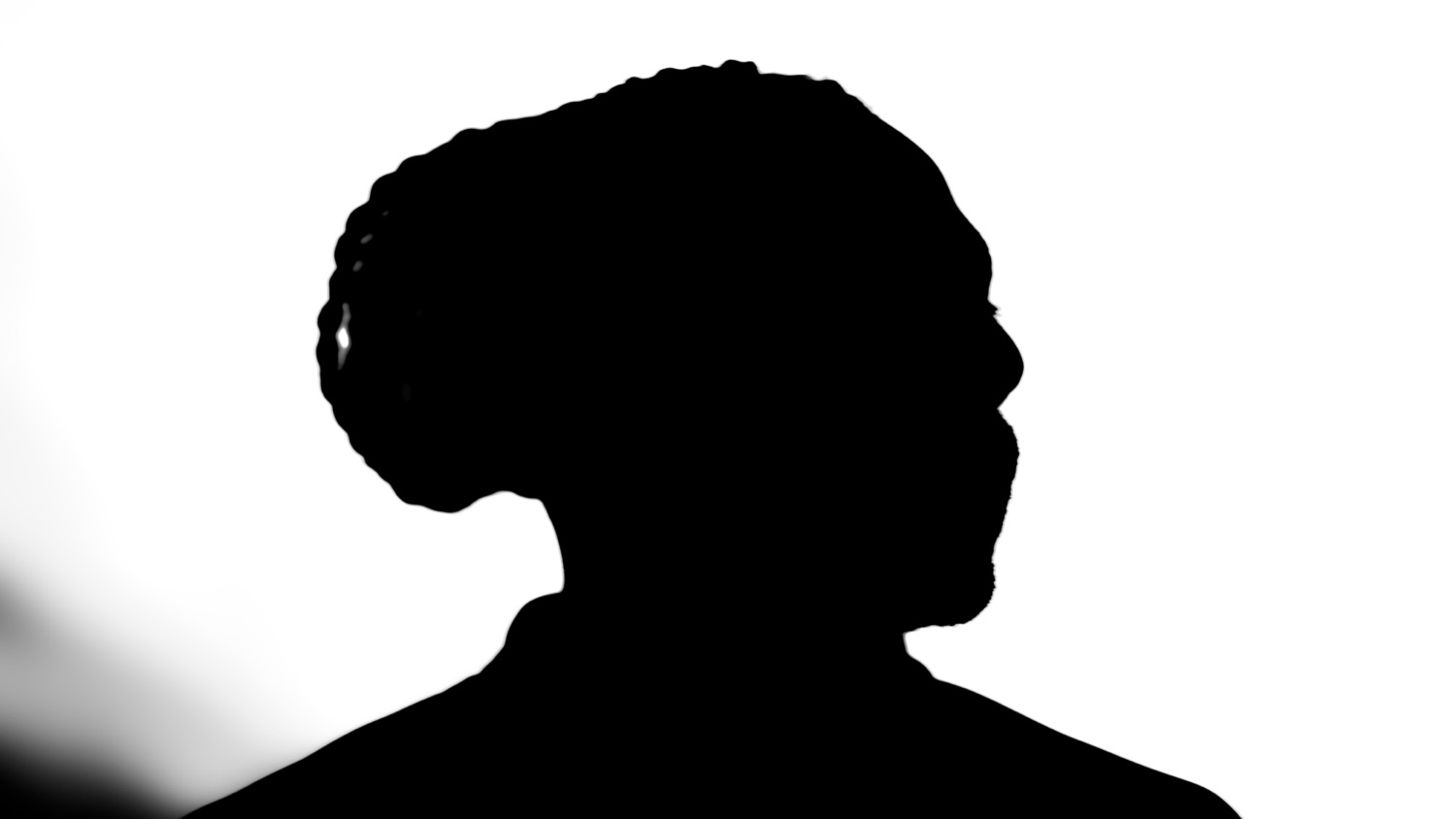 A profile silhouette cut out in black and white